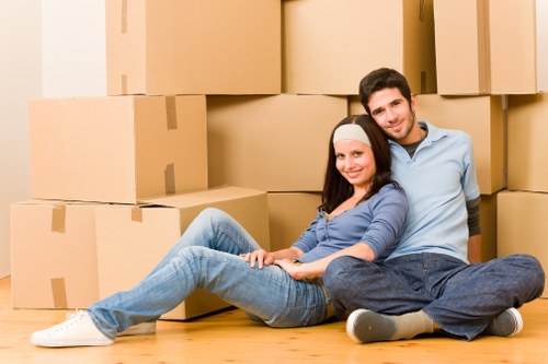 Moving team handling furniture during house removals in Collierrow