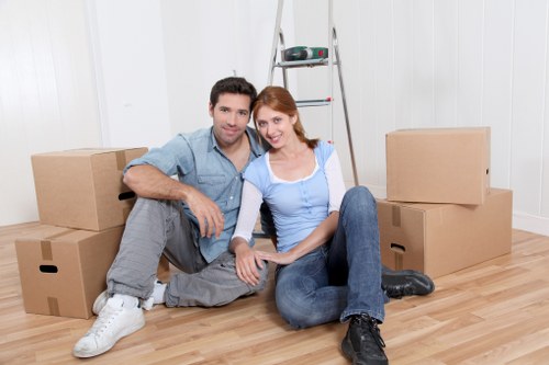 Local packing team preparing household items for transport