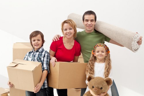 Packed moving boxes and protective wrap for a house move in Collierrow