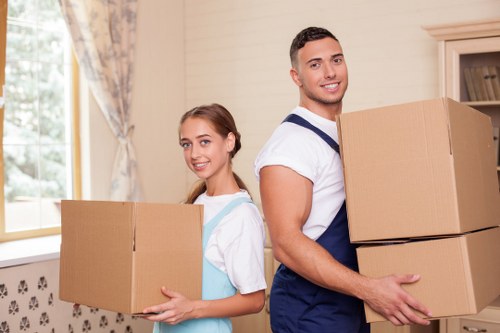 Professional movers loading furniture during a Collierrow home move